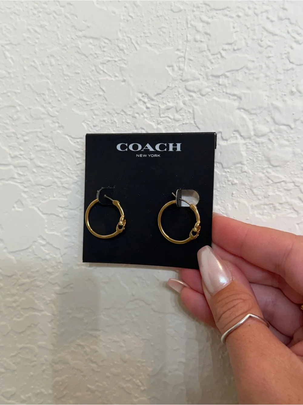 COACH White Drawstring Pouch with Gold Hoop Earrings